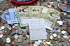A bundle of cash left in a donation box at Gimhae International Airport by a person presumed to be a Japanese tourist is seen in this photo. The money was left in the donation box along with a note written in Japanese. [YONHAP]