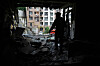 A resident stands in the damaged apartment in a multi-story house after a Russian attack in Kyiv, Ukraine on July 21. [AP/YONHAP]