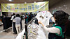 Parents purchase donated middle and high school uniforms from schools in Gwacheon, Gyeonggi, on Feb. 5. [NEWS1]