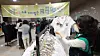 Parents purchase donated middle and high school uniforms from schools in Gwacheon, Gyeonggi, on Feb. 5. [NEWS1]