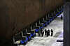 North Korean leader Kim Jong-un inspects what appears to be a nuclear-powered strategic missile submarine under construction at a facility in North Korea on March 8. [RODONG SINMUN]