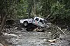 A damaged truck is seen on the banks of the river in Ruidoso, New Mexico on July 9, a day after major flooding washed away properties and Rv's along the Rio Ruidoso Tuesday afternoon. [AP/YONHAP]