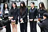 NewJeans members respond to questions from the media at the Seoul Central District Court in Seocho District, southern Seoul, on March 7. [NEWS1]