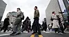 Office workers hurry to work at Gwanghwamun Intersection in Jongno District, central Seoul on April 14. [NEWS1]