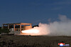 In this photo released by Pyongyang's state-controlled Korean Central News Agency on Wednesday, the ground test of a new solid-fuel missile engine for the North's intermediate-range ballistic missiles is underway. [YONHAP]