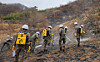 Service members put out remaining fires in Miryang, South Gyeongsang, on Feb. 24. [YONHAP]