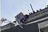 Paramedic holds driver for 45 minutes in dramatic bridge rescue