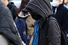 Commuters brace against the cold at Gwanghwamun intersection in central Seoul on Oct. 21, as early winter chill grips the city with morning temperatures dropping to 4.8 degrees Celsius. [NEWS1]