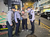 Police stop a man during a patrol in Gangdong District, eastern Seoul, on Nov. 6. [SEOUL METROPOLITAN POLICE]