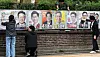 Election officials hang up presidential candidate posters at a wall in Jongno District, central Seoul on May 15. [NEWS1]