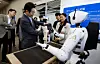 President Lee Jae Myung looks at a humanoid robot performing a cup-stacking demonstration at Startup Square in Seongnam, Gyeonggi, on Sept. 17, 2025. [JOINT PRESS CORPS]