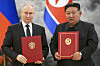 Russian President Vladimir Putin, left, and North Korea's leader Kim Jong-un pose for a photo during a signing ceremony of a new partnership in Pyongyang, North Korea, on June 19, 2024. [AP/YONHAP]