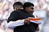 The Netherlands' Lee, right, embraces Korea's Kim Hong-yul after their battle in the B-Boys round robin at the Paris Olympics on Saturday. [AFP/YONHAP]