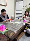 Participants learn how to make a lotus lantern at Mireuksa. [YIM SEUNG-HYE]