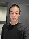 Jin poses for the camera after getting his hair shaved in preparation for military enlistment in a photo he uploaded on Weverse on Dec. 11, 2022, two days before he began his military service. [WEVERSE]