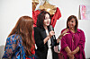 Jeamin Seung, center, speaks about her artwork during the opening reception of a special exhibit, 'The Greatness of Women,' at the Naples Fashion Museum in Naples, Italy on Oct. 12. [NAPLES FASHION MUSEUM]