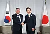 Korean President Lee Jae Myung, right, and Japanese Prime Minister Shigeru Ishiba shake hands ahead of bilateral talks on the margins of the Group of Seven, or G7, summit in Canada on June 17. [JOINT PRESS CORPS]