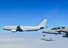 A KF-21 fighter jet, center, flies while connected to a KC-330 tanker aircraft during an aerial refueling test off the southeastern coast of Korea in March. [DEFENSE ACQUISITION PROGRAM ADMINISTRATION]
