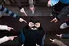 A child being bullied by a group of children. bullying scene [SHUTTERSTOCK]