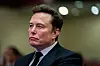 Tesla CEO and X owner Elon Musk listens as U.S. President-elect Donald Trump speaks during a meeting with House Republicans at the Hyatt Regency hotel in Washington on Nov. 13, 2024. [REUTERS/YONHAP]