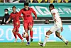 Korea's Lee Kang-in, left, dribbles the ball during a friendly with Vietnam at Suwon World Cup Stadium in Suwon, Gyeonggi on Tuesday. [YONHAP]