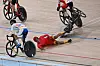 A Korean cyclist passes on the inside as China's Wu Junjie falls in the men's madison final at the Asian Games in Hangzhou, China on Friday. [AFP/YONHAP]