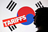 A 3D-printed miniature model of U.S. President Donald Trump, the Korean flag and the word ″Tariffs″ are seen in this illustration taken on July 23. [REUTERS/YONHAP]