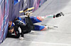 Kim Gil-li of Korea, left, slams into the boards after falling over Corinne Stoddard of the United States during the semifinals of the mixed team relay in short track speed skating at the Winter Olympics at Milano Ice Skating Arena in Milan on Feb. 10. [NEWS1]