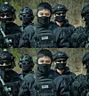 V is seen in photos released by the Army training center on April 17, 2024 with a caption stating that he has been assigned to serve in a special mission unit under the military police. [JOONGANG ILBO]