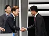 Lee Jae-myung of the Democratic Party, left, greets Kim Moon-soo of the People Power Party ahead of the second televised presidential debate on May 23 at the KBS studio in Yeongdeungpo District, western Seoul. [JOINT PRESS CORPS]