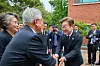 Democratic Party presidential candidate Lee Jae-myung, right, shakes hands with former President Moon Jae-in during a memorial service marking the 16th anniversary of the death of former President Roh Moo-hyun in the rural village of Bongha in Gimhae, southeastern Korea, on May 23. [YONHAP]