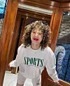 HyunA uploaded a photo on Instagram showing her wearing a curly wig she picked up from a Paris beauty store for afro-textured hair. Her post was met with backlash from international fans, criticizing her for cultural appropriation. [SCREEN CAPTURE]