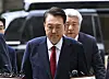 Former President Yoon Suk Yeol, who is under investigation by the special counsel in connection with the Dec. 3 martial law case, heads to a courtroom at the Seoul Central District Court in Seocho District, southern Seoul, on July 9 to attend a pretrial detention hearing. [JOINT PRESS CORPS]