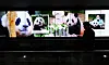 A passerby walks past a display of videos featuring Fu Bao at Terminal 1 in Incheon International Airport on March 21. [YONHAP]