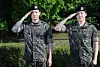 Members Jungkook, left, and Jimin of boy band BTS salute to fans after finishing their military duties on June 11 in Yeoncheon, Gyeonggi. [NEWS1]