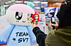 A fan of Seventeen, or Carat, takes photos in front of Seventeen's mascot, Bongbong, at the lounge prepared for guests taking Seventeen themed trains. [HYBE]