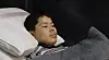 A captured North Korean soldier responds to questions from Ukrainian investigators with the help of a Korean interpreter while lying in bed in this video released by Ukrainian President Volodymyr Zelensky on X on Jan. 14. [SCREEN CAPTURE]