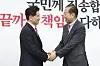 Ex-Labor Minister Kim Moon-soo, left, is welcomed by conservative People Power Party (PPP) interim leader Kwon Young-se at the National Assembly in western Seoul on April 9. Kim visited the parliament to join the PPP. [LIM HYUN-DONG]