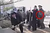 Defense Minister No Kwang-chol taps Kim Ju-ae on the back in a footage shared by North Korea state media. [SCREEN CAPTURE]
