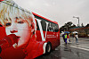 A red chartered bus featuring BTS V's face parked in front of the military boot camp in Nonsan, South Chuncheong on Monday, as members V and RM begin their mandatory military service. [YONHAP]