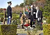 Sgt. Donald Northey's son Michael Northey, second from right, stands in front of his father's grave at the United Nations Memorial Cemetery in Busan as a member of the Gloucestershire Regiment lays a wreath of red poppies on his rededicated headstone. His wife Linda Northey stands next to him on the right. [PARK SANG-MOON]