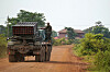 A Cambodian soldier stands on a BM-21 Grad multiple rocket launcher, around 40 kilometers (24 miles) from the disputed Ta Moan Thom temple, after Thailand and Cambodia exchanged heavy artillery on July 25 as their worst fighting in more than a decade stretched for a second day, in Oddar Meanchey Province, Cambodia. [REUTERS/YONHAP]