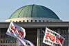 Flags carried by protesters calling for the impeachment of former President Yoon Suk Yeol are seen near the National Assembly building on April 4. [KIM JONG-HO]