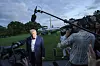 U.S. President Donald Trump speaks with reporters after disembarking from Marine One upon arrival on the South Lawn of the White House in Washington on May 4. [AP/YONHAP]