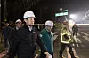 Seoul Mayor Oh Se-hoon, left, inspects the area near a 20-meter-wide sinkhole that appeared at an intersection in Gangdong District, eastern Seoul, on March 24. [NEWS1]