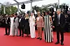 Jury president Juliette Binoche, fourth from left, and jury members Carlos Reygadas, Leila Slimani, Payal Kapadia, Dieudo Hamadi, Alba Rohrwacher, Jeremy Strong, Halle Berry and Hong Sang-soo pose for photographers during the opening ceremony red carpet of the 78th international film festival, Cannes, southern France, May 13. [AP/YONHAP]