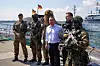 German Defense Minister Boris Pistorius, center, accompanied by the commander of the Sea Battalion, Frigate Captain Patrick Steinbach, poses with soldiers for a group photo at the naval base during his visit to the Navy troops in Eckernforde on July 19, 2024. [EMBASSY OF GERMANY]