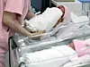 A nurse takes care of a newborn at Korea University Guro Hospital in western Seoul on May 28. [NEWS1]