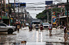 People commute through a flooded area in Hat Yai District, Songkhla Province, Thailand, on Nov. 28. [REUTERS/YONHAP]