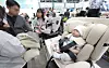 Visitors examine childcare products at the 42nd Daegu Baby & Kids Fair at Exco in Buk District, Daegu, on Nov. 7, 2024. [YONHAP]